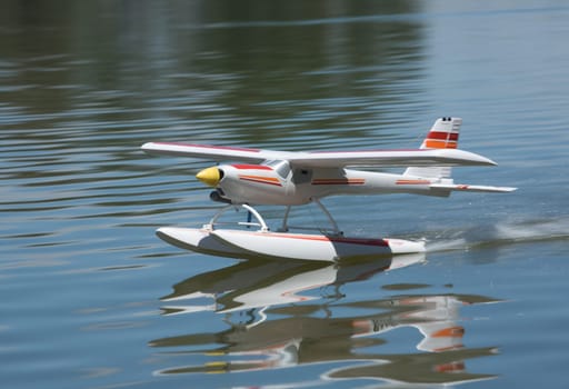 Radio controlled Hydroplane flying and sailing over the Guadiana river surface, Badajoz, Spain