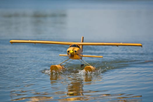 Radio controlled Hydroplane flying and sailing over the Guadiana river surface, Badajoz, Spain