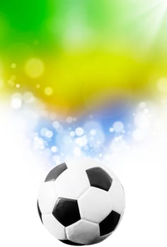 Soccer ball on blue, yellow and green background representing the colors of the Brazil flag