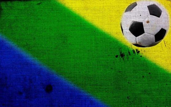 Vintage photo of soccer ball and the colors of the Brazil flag