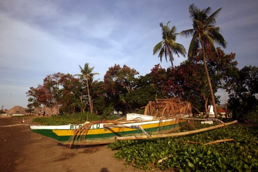 Fishermen on the city beach of Dili of the capital of East Timor on the two separate island of Timor in Asia.