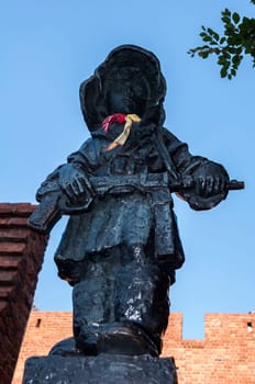 Monument of the little insurgent in Warsaw Old Town, Poland.