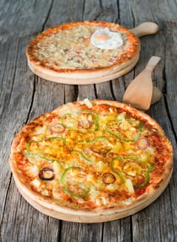 Delicious italian pizza served on wooden table