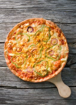 Delicious italian pizza served on wooden table