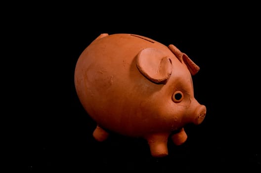 Ceramic Pink Piggy Bank isolated on a Black Backgriund