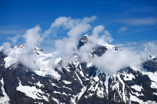 Alps Austria,summit of the Wiesbachhorn with clouds in the Hohe Tauern