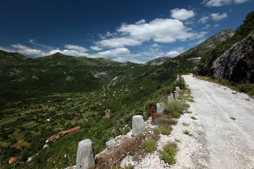 The landscape with the pass road between Rijeka Crnojevica and Cetinje in Montenegro in Europe.