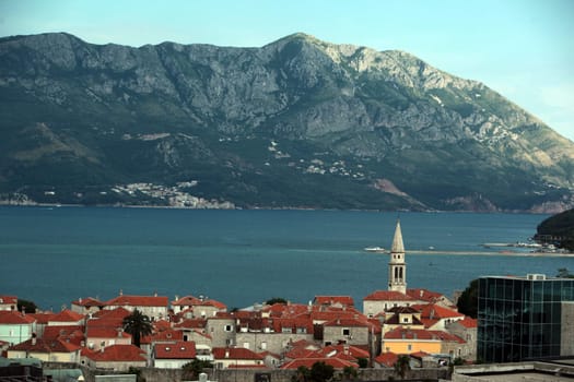 The old town with the church Of Sv. Ivan Krstitelji of the Adriatic city of Budva with many new apartments in Montenegro in the Balkans on the Mediterranean Sea in Europe.