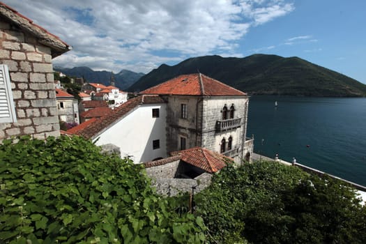 The village of Persat in the bay of Kotor on the Mediterranean Sea in Montenegro in the Balkans in Europe.