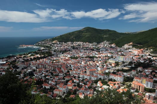 The modern center of the Adriatic city of Budva with many new apartments in Montenegro in the Balkans on the Mediterranean Sea in Europe.