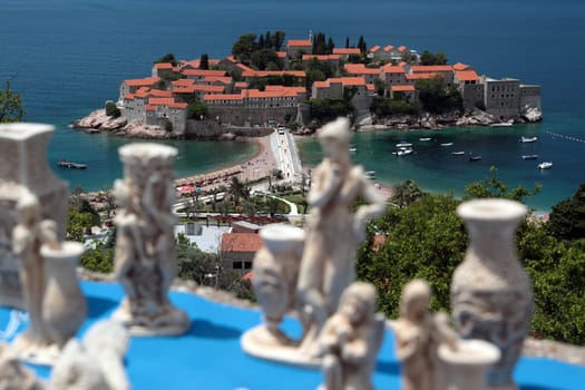 The old town island of Sveti Stefan in the Adriatic Sea on the coast in Montenegro in the Balkans on the Mediterranean Sea in Europe.