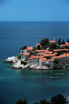 The old town island of Sveti Stefan in the Adriatic Sea on the coast in Montenegro in the Balkans on the Mediterranean Sea in Europe.