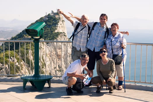 Portrait of happy tourist people on the Rock of Gibraltar.