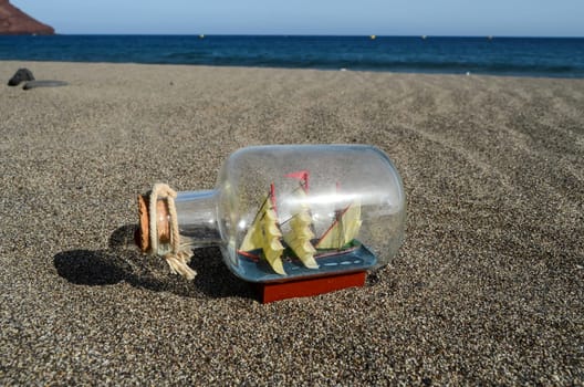 Sail Ship Toy Model in the Beach Sand Close-up