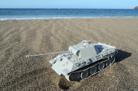 War Concept Gray Tank Model on the Beach