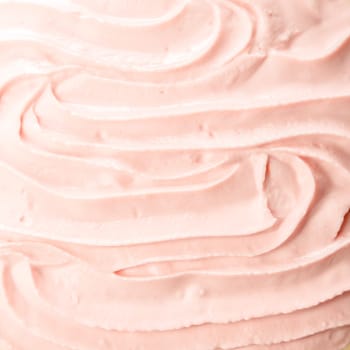Tasty cold pink berry frozen yoghurt or ice cream background with a smooth creamy texture for a delicious refreshing summer dessert