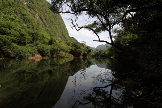 The landscape on the Nam Don or Don River near the village of Tha Falang of Tham Pa Fa near the town of Tha Khaek in central Laos on the border with Thailand in South East Asia.
