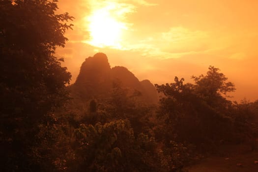 The hilllandscape on highway 12 between the town of Tha Khaek and the village of Mahaxai Mai in central Laos on the border with Thailand in South East Asia.