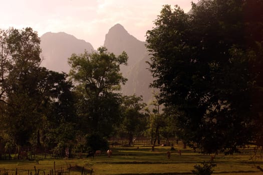 The hilly landscape on highway 12 between the city of Tha Khaek and the village of Mahaxai Mai in central Laos on the border with Thailand in South East Asia.