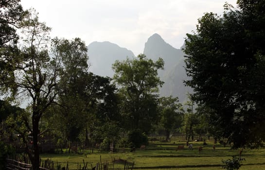 The hilly landscape on highway 12 between the city of Tha Khaek and the village of Mahaxai Mai in central Laos on the border with Thailand in South East Asia.