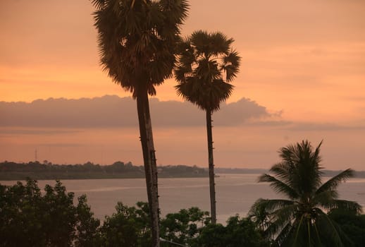 The landscape of the border river Mekong River in the town of Tha Khaek in central Laos on the border with Thailand in South East Asia.
