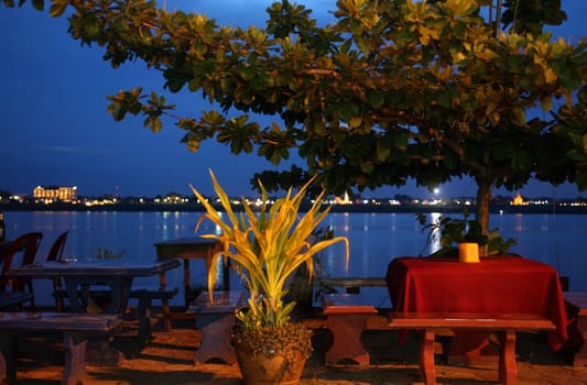 The Old Town center with the night market square on the border river Mekong River in the town of Tha Khaek in central Laos on the border with view of Thailand in South East Asia.