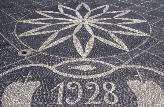 The stone floor in front of the church Igreja Nossa Sennhora da Piedade of the village of Porto Santo on the Portuguese island of Porto Santo near Madeira in the Atlantic Ocean