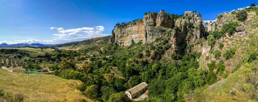Ronda panoramic view. A city in the Spanish province of Málaga, within the autonomous community of Andalusia. Is situated in a very mountainous area about 750 m above mean sea level. The Guadalevín River runs through the city, dividing it in two and carving out the steep, 100 plus meters deep El Tajo canyon upon which the city perches
