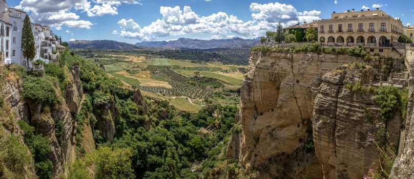 Ronda panoramic view. A city in the Spanish province of Málaga, within the autonomous community of Andalusia. Is situated in a very mountainous area about 750 m above mean sea level. The Guadalevín River runs through the city, dividing it in two and carving out the steep, 100 plus meters deep El Tajo canyon upon which the city perches