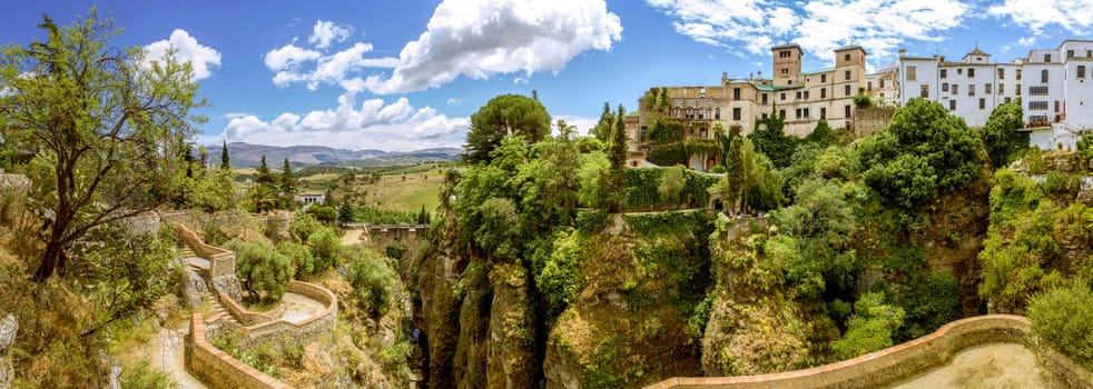 Ronda panoramic view. A city in the Spanish province of Málaga, within the autonomous community of Andalusia. Is situated in a very mountainous area about 750 m above mean sea level. The Guadalevín River runs through the city, dividing it in two and carving out the steep, 100 plus meters deep El Tajo canyon upon which the city perches