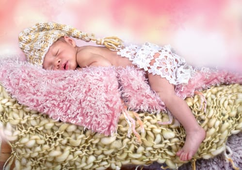 newborn girl with cap