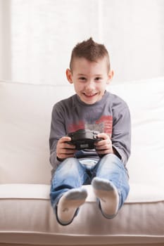 Kid having fun with video games in a brighly lit living room
