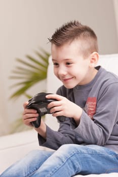 Kid having fun with video games in a brighly lit living room