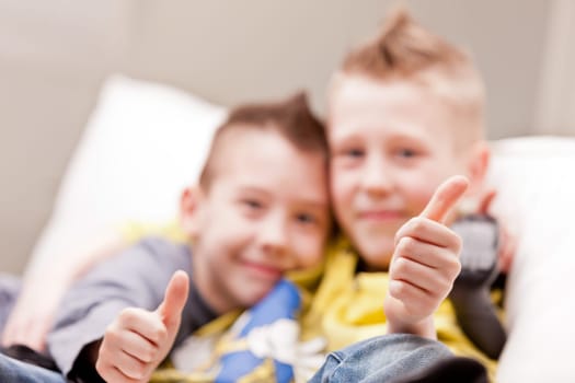 two little boys having lots of fun with video games