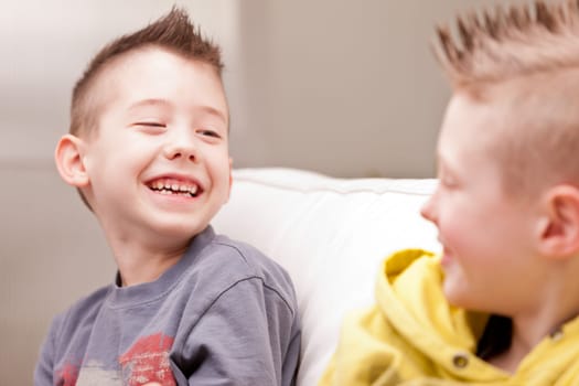two little boys having lots of fun with video games