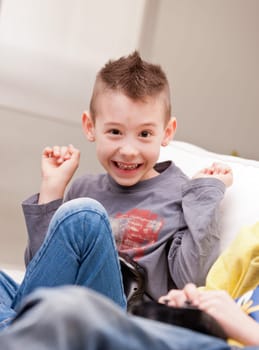 Kid having fun with video games in a brighly lit living room