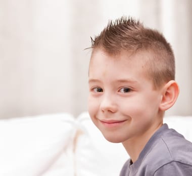 a very cute little boy smiling