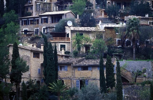 The farming village of Deia or Deya with the old traditional stone houses in February 2005 in the north-west of the island of Mallorca one of the Balearic islands in the Mediterranean.