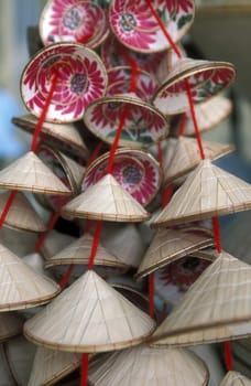 Small Vietnamese straw huete at the market in the district of Cholon in Saigon in the south of Vietnam in South East Asia.