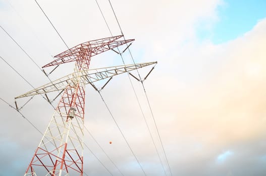 Power Electric Tower on a Cloudy Sky at Sunset