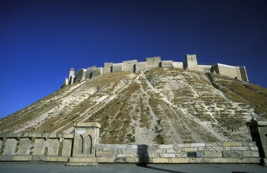 The citadel in the Old City of Aleppo in northern Syria in the Middle East in Arabia.