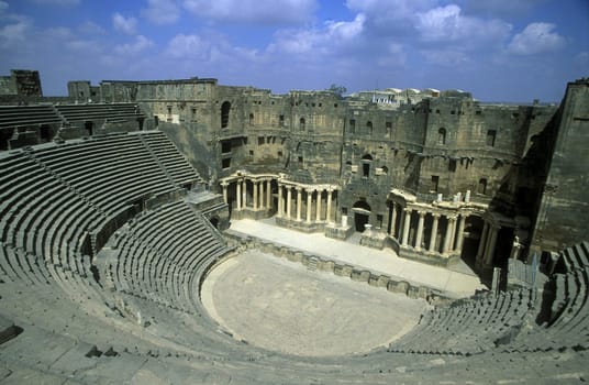 The ruins of the Roman Theatre in the town of Bosra in the south of Syria in the Middle East.