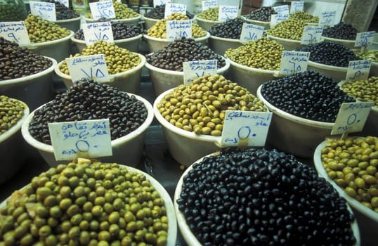 Olives at the Souq or market in the medina of the Old City of Aleppo in the north of Syria in the Middle East.