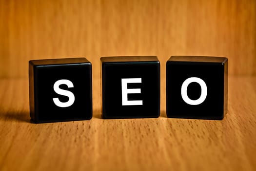 SEO or Search engine optimization text on black block