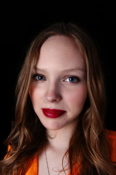 A closeup portrait picture of a lovely teenage girl with blue eye's, .isolated for black background..