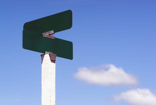 Blank street signs against blue sky ready for your creativity