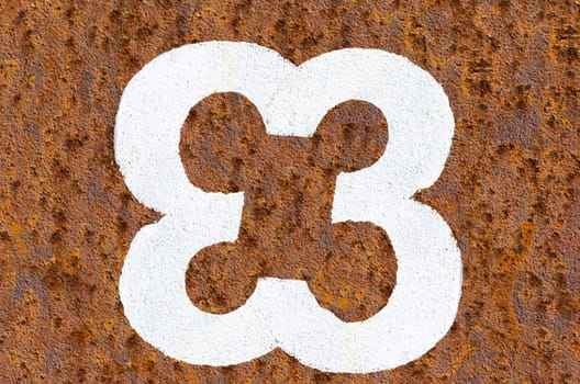 Rusty iron background with beautiful structure and digit in white color.