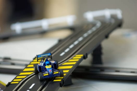 The toy of the racing car on track