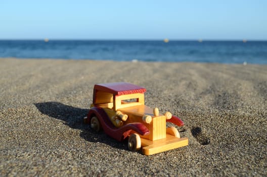 Toy car on Sand Beach Trasportation Concept