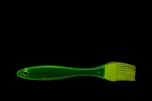 Green Kitchen Silicone Brush on a Black Background
